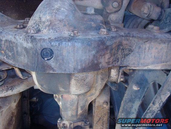 30drain.jpg I knew it wouldn't be exactly aligned, so I'll widen the hole with a burr one of these days.

[url=https://www.supermotors.net/registry/media/766017][img]https://www.supermotors.net/getfile/766017/thumbnail/25drainpilot.jpg[/img][/url] . [url=https://www.supermotors.net/registry/media/766018][img]https://www.supermotors.net/getfile/766018/thumbnail/26tap.jpg[/img][/url] . [url=https://www.supermotors.net/registry/media/766020][img]https://www.supermotors.net/getfile/766020/thumbnail/27plug.jpg[/img][/url] . [url=https://www.supermotors.net/registry/media/766031][img]https://www.supermotors.net/getfile/766031/thumbnail/28assembled.jpg[/img][/url] . [url=https://www.supermotors.net/registry/media/849741][img]https://www.supermotors.net/getfile/849741/thumbnail/drainplugsmag.jpg[/img][/url]

Later 3rd members have a boss that extends farther behind the lip of the beam, so the plug could be placed there without having to hole-saw the beam.