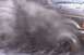 1993 Ford Bronco - Ford Bronco driving through mud, splashing water and dirt.