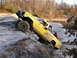 1994 Ford F-250 - Off-road truck navigates a challenging, steep, and rocky terrain with two people assisting.
