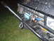 1984 Ford Bronco II - Front view of a 1984 Ford Bronco II a winch mounted behind a custom brush guard.