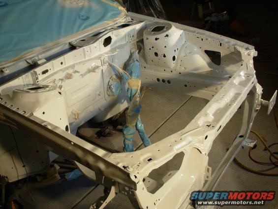 White engine bay frame with blue protective coverings