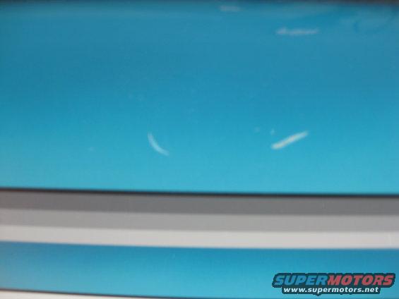 Blue hull with white scratches and Supermotors.net logo