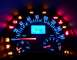 2003 Volkswagen Beetle - Illuminated dashboard of a 2003 Volkswagen Beetle, displaying mileage and speed with multiple warning lights active.