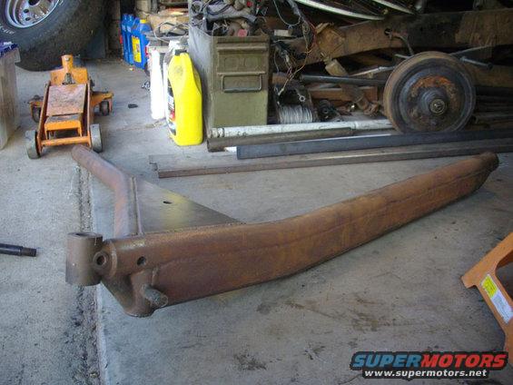 Rusty metal suspension part on concrete floor