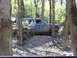 1994 Ford F-250 - A Jeep Cherokee XJ navigates a muddy, wooded trail.