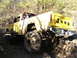 1994 Ford F-250 - This modified Jeep pickup truck navigates a challenging off-road course.