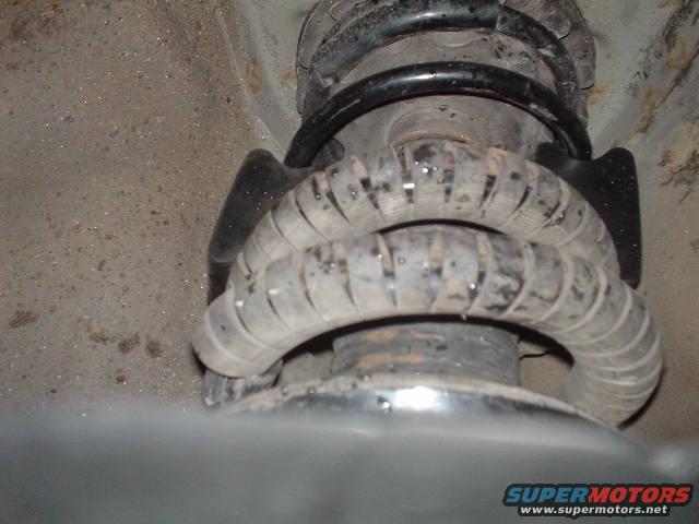 dsc00397.jpg This is a picture of the coil spacers i used to raise the sagging back end of my car. It raised it about 3/4" - 1". It also helped firm up the back end....probbaly the best $8.00 ive spent on the car.