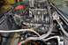 1996 Ford Bronco - Close-up view of a vehicle's engine bay, showing the intake manifold and associated components.