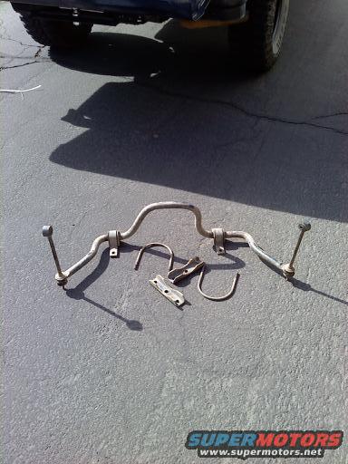 Anti-roll bar and mounting hardware on pavement