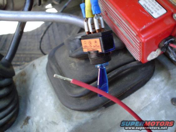 the smaller red wire, thats next to the white wire that never gets used, goes to a 12V switched source. this case its the blue switch... turn it on and use the key to start it turn it off engine stops... turn off key.
