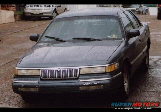 Front view of a dark gray 1992 Mercury Grand Marquis parked outside