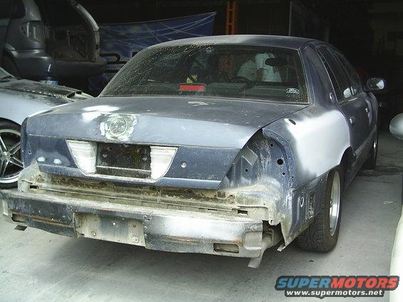 1992 Mercury Grand Marquis rear end being repaired, primer on rear quarter panels