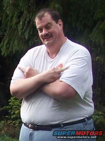 Man pointing with arms crossed. "SUPERMOTORS www.supermotors.net" text visible