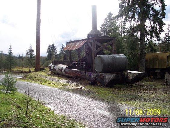 Old logging equipment with a large log base and a cylindrical tank