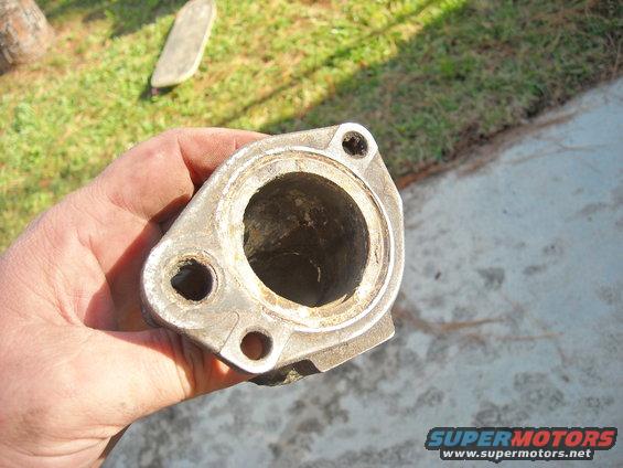 clean_housing.jpg This is after scraping off the nasty gasket and hitting it with sandpaper to clean it up.
Once I finished this, I also cleaned up the hose inserts and then wiped everything down with a rag.