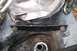 1992 Ford C-350 (Centurion Conversions) - Close-up view of an engine mount bracket, showing bolts and metal construction.