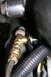 1992 Ford C-350 (Centurion Conversions) - Engine compartment detail showing a brass fitting and associated plumbing.