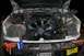 1992 Ford C-350 (Centurion Conversions) - Engine bay of a truck, showing various components and some tools nearby.