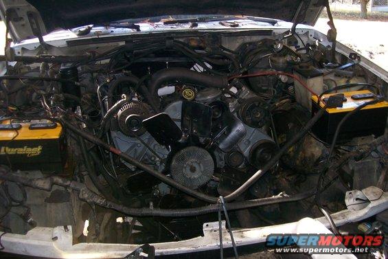engine bay with batteries and fan visible