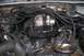 1992 Ford C-350 (Centurion Conversions) - Close-up view of an engine bay, focusing on the turbocharger and associated plumbing. Text from SuperMotors.net is visible.