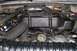 1992 Ford C-350 (Centurion Conversions) - Close-up view of the engine bay, focusing on the engine components and associated hoses.
