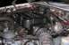 1992 Ford C-350 (Centurion Conversions) - Close-up view of an engine bay, showing various components and hoses.