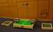 1990 Ford Bronco - A tabletop soccer game is set up on a carpeted floor in front of a wood-paneled wall.