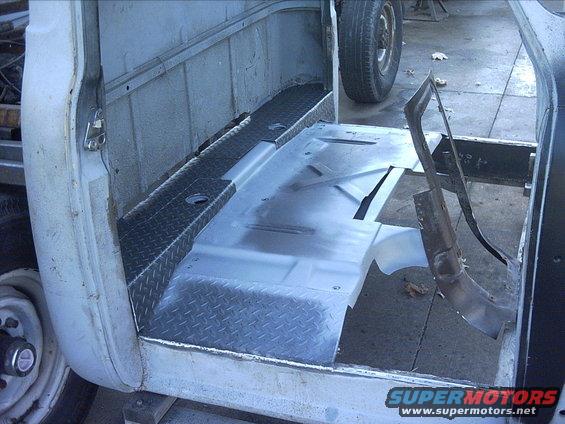 11-03-08:   I also did a lot of clean up with a grinder, flap wheel and wire brush on the rear floor section. Then I sprayed some weld thru primer. I was just going to spray the areas I was going to cover up but I got a little carried away. :lol:  I also cut out most of the cab brace I installed. I did leave the front crossbar in place until I get the front floors in. 

I have some issues with those rear diamond plate panels I made. I'm still trying to decide if I want to make a couple new ones or try to work with the ones I made. I made a couple mistakes on them so they don't fit as well I want. :mad: