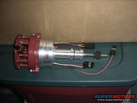 30964780294_large.jpg 8-19-09:   Got a new toy in the mail today. It's a Mallory Max-Fire distributor for my 351W.

I didn't plan on buying this until later on but I came across it at a good price while searching for some other stuff. Summit racing listed this for around $407.00. Well surprisingly I found it at Amazon.com for $325.00. At that price I decided I better get it now.

If you don't know the Mallory Max-fire distributor it a billet distributor with ball bearing. It has a completely computer tuneable elctronic vacuum and "mechanical" advance set up. No tearing down the distributor, changing springs, or messing with counter weights. Just plug in a lap top and change the advance curve. It also has a built in multi-strike digital ignition system with a rev limiter. So no need for a big external ignition box. You still need to run a separate coil though. Should be fun.