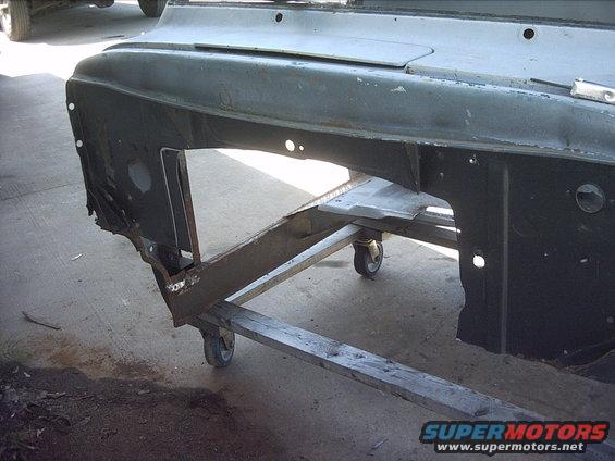 30964780274_large.jpg 5-30-09:  Then I trimmed the rear floor a little. and cleaned up the left over welds from the old transmission tunnel. After that I spent a lot of time ( 2 hours ) measuring, test fitting, more measuring and finally marked out the firewall so I could cut it out to fit the 87 transmission tunnel. Then I pulled the transmission tunnel back out and cut out the firewall with my jigsaw.