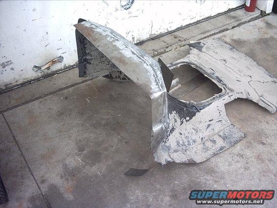 30964780265_large.jpg 5-25-09: After I finished the welding I started grinding down the welds. I still have a ways to go but it's looking ok. I need to go back over it and do some more grinding and weld up any pin holes I missed on the first pass. And I've also got plenty of hammer and dolly work to do on it. Then I need to do it all over on the other side.