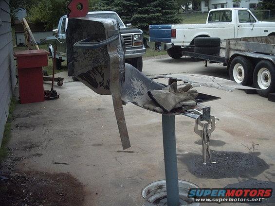 5-25-09:  Yesterday I made up a little stand that I could clamp body panels to when I need to work on them. A couple years back my dad brought home a mobile bench grinder stand that they were tossing out at his work. I didn't really like it because it had a huge base plate. I was always tripping over it. The problem was the top plate was pretty small. Too small to really do anything useful with. Well I was looking at it yesterday and decided if I flipped it upside down it would make a good work table. :think: So I welded a wide rim onto the end with the small plate. Then I welded a couple pieces of 1"x2" tubing to the rim so I'd have a place to mount the casters to ( I still need to drill some hole to mount the casters ) . And presto I've got a work stand.

 

Today bolted a couple brackets to my "new" work stand. This gave me a wider area to clamp stuff to. After I finished that I clamped my transmission tunnel to the stand. Then I clamped the one fire wall recess extension piece to it. When I clamped the extension on i used the copper panels on the back side of the seams.