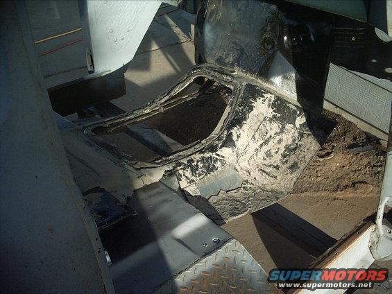 30964780245_large.jpg 5-03-09:    Next on the list was to do some trimming to the new firewall recess/transmission tunnel.  I got it where I want it for now. I need to add a 2" strip of metal to the firewall recess where it meets the firewall. That's just to make sure the recess is deep enough.