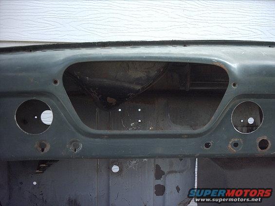 30964780247_large.jpg 5-11-09:  Today I decided to work on a different area of the cab just for a break from the floor/structure.

I decided to drill a couple holes to mount a couple gauges in the dash. I was going to mount them both to the right of the instrument cluster but I ended up going with one gauge on each side of the instrument cluster. I just liked the way this looks better. I took a few measurements and then used my 2 5/8" hole saw to drill two holes in the dash.