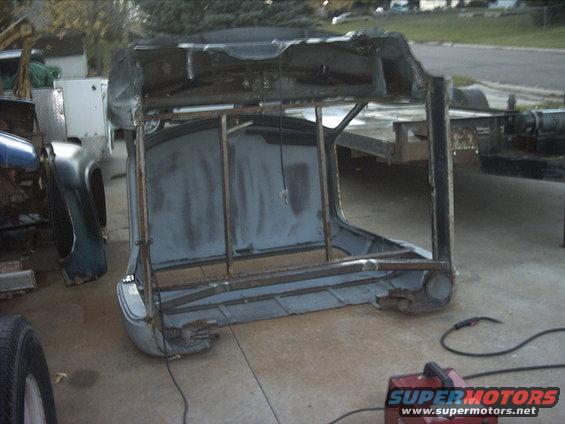 30964780119_large.jpg 10-25-08: Today I pulled the windshield out of the cab and tipped the cab on it's back panel. Then I finished the welding on the rockers and the bottom of the crossmember.

The one picture is a little blurry my batteries are getting weak.

If it's not snowing too heavy tomorrow I'm going to weld the rear floor in.