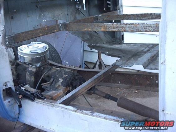 3096478_71_full.jpg 10-02-08: I dug out my little Hobart plasma cutter and started cutting. Here's a couple pics of the driverside floor cut out.