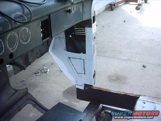 30964780233_large.jpg 4-17-09:    Next I pulled my template back out for the passenger side plate so I could figure out where to locate the access holes. And this is where I made the big screw up today.  When I positioned the lower access hole I completely forgot about the passenger side front cab mount bracket.  I didn't realize I did this until I had already marked out the panel and cut the holes out. I had the plate back in place on the cab and was working on a template for the diamond plate cover. That's when I figured out my screw up.  I tried the cab mount bracket and you guessed it sits right on the lower corner of the access hole.  So now I'm going to have to cut a piece of 10 gauge steel and weld it back into position. This is the point I got mad at myself and decided it was time to quit for the day before I screwed up something else! 