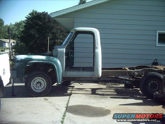 3096478_31_full.jpg 7-08-08:  I got the cab almost in the position it will be mounted in. I still need to go a couple inches farther forward but I'll have to cut out the firewall and floor to do it.

I bolted on the one F600 front fender. You can see the wheel well opening that the cab needs to go a little farther forward. I'm going to try the F100 front fenders on it too to see if I need the F600 fenders.

The body will sit a little lower on the frame once it's mounted.

Here's how it looks now.