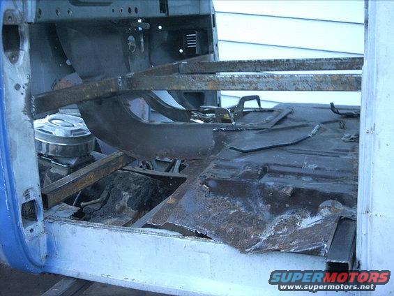 3096478_87_full.jpg 10-04-08:  Then I did some measuring and a little trimming on the transmission tunnel. I did a little test fit to see how much more material I'll need to remove.

This coming week isn't looking good weather wise.  I need some more nice dry days to make some progress before the snow flies.