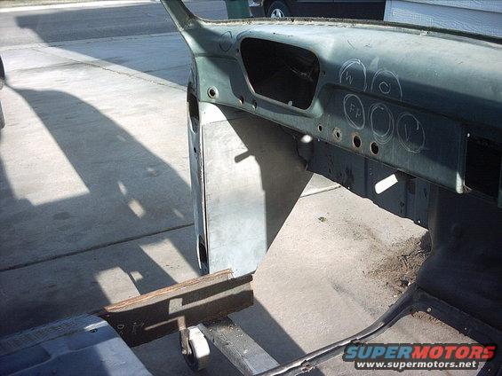 4-15-09:   I took the driver side plate did some test fitting, some grinding, a little cutting and got it to pretty much fit. I had to cut a slit in the cab just below the hood hinge mounts so I could get the plate to sit flat. Luckily I don't need no stinkin hood hinges! :lol:  I still need to do a little more grinding on the plate to get a good fit. I'm going to do that tomorrow. I'll get the passenger side to fit good also then I'll cut the centers out of them for my access holes and then weld them in.

With all the metal I'm adding to this cab I'm going to need a crane to lift it onto the chassis!
