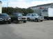 1993 Ford Bronco - A white 1993 Ford Bronco is parked in a lot with other vehicles.