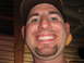 1993 Ford Bronco - A man smiles for a selfie, showing his teeth and goatee.