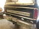 1975 Ford F-250 - This 1975 Ford F-250 pickup truck features a black exterior, chrome bumpers, and a distinctive rear tailgate with the Ford logo.