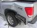 2008 Nissan Titan - This silver 2008 Nissan Titan Pro-4X shows significant damage to its rear quarter panel and bumper.