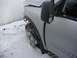 2008 Nissan Titan - A silver pickup truck with a V8 TITAN badge sits damaged in the snow, its front wheel severely bent.