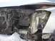 2008 Nissan Titan - Front end damage on a 2008 Nissan Titan, showing bent metal and exposed components.