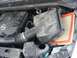 2008 Nissan Titan - The engine bay of a Nissan Titan shows the V8 5.6 engine with the air filter exposed.