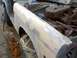 1972 Ford Bronco - Fender undergoing bodywork, revealing the engine compartment and parts of the vehicle's interior.
