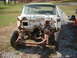 1957 Ford Custom Sedan - This heavily rusted car chassis, viewed from the front, appears to be from the 1950s, but does not match the claimed 1957 Ford Custom Sedan.