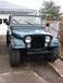 1979 Jeep CJ7 - Front view of a green 1979 Jeep CJ7 parked in a driveway.